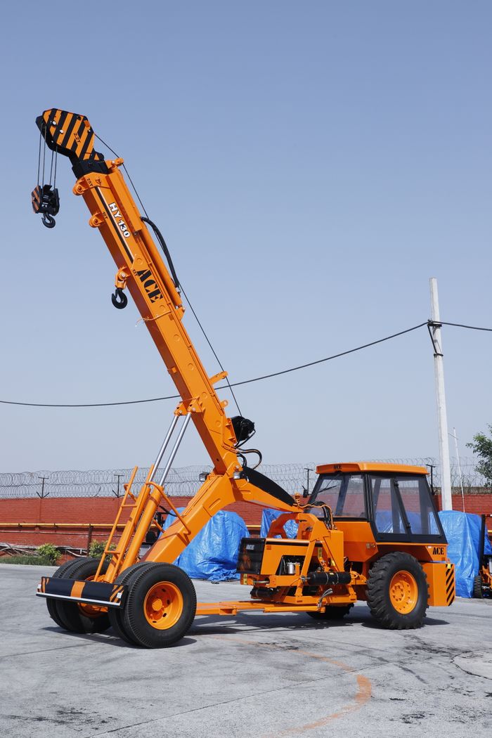 gallery-3 ACE HY130 crane parked outdoors in an industrial setting in Faridabad, India.