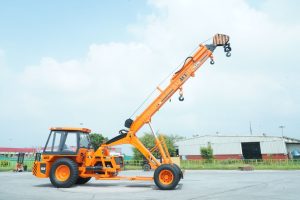 ACE Hydra crane standing in an outdoor industrial yard in Faridabad, India.